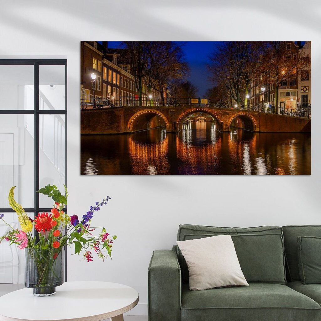 Romantic view from the Herengracht of the classic arched bridges of the Leidsegracht