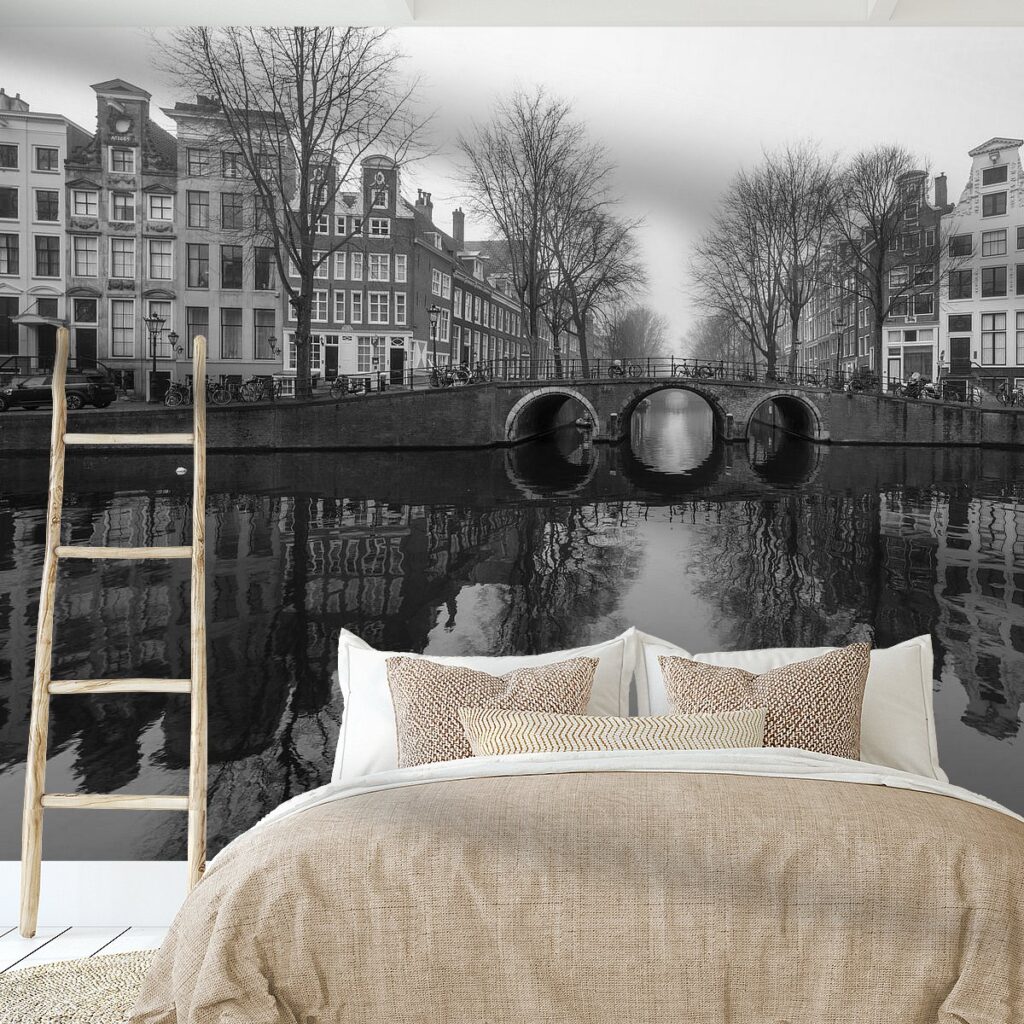 Atmospheric and minimalist winter photo of a deserted Herengracht in dense fog.