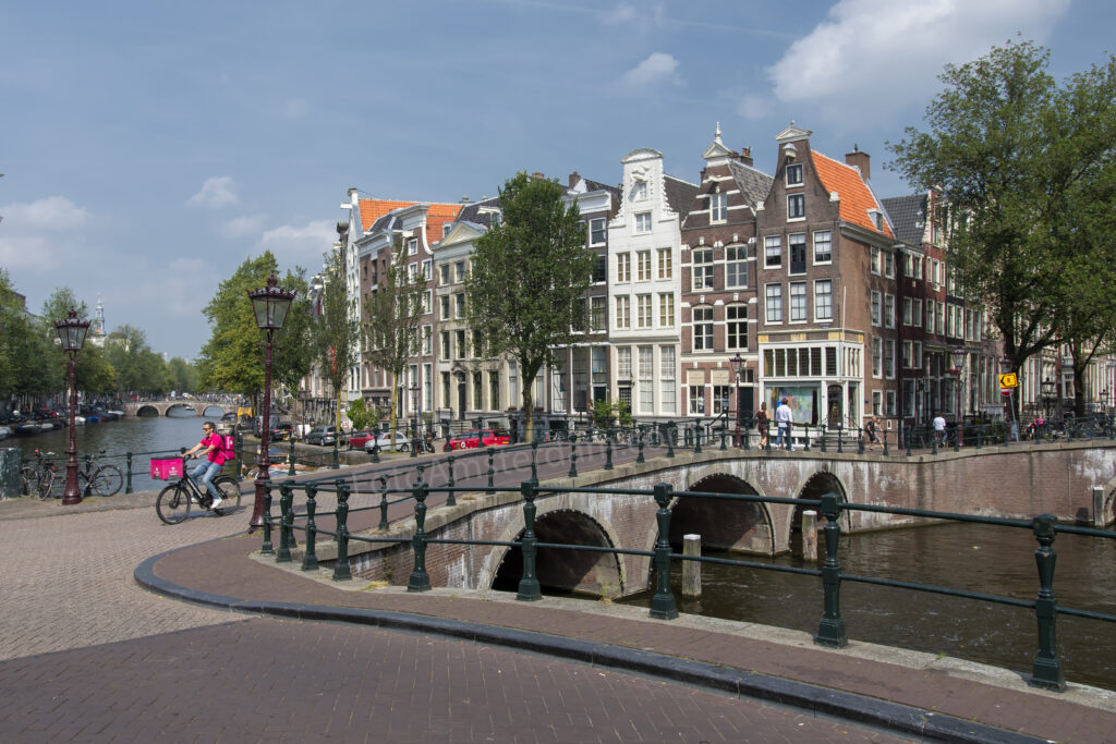 Historic bridge crossing the Keizersgracht with elegant canal houses in Amsterdam