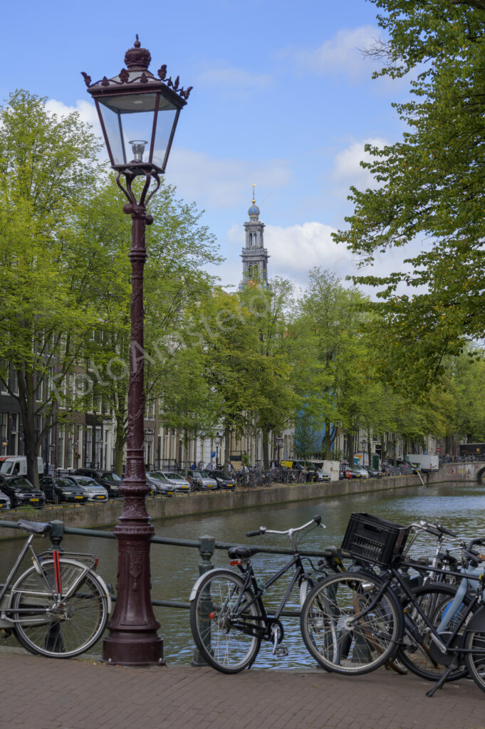 Traditional Amsterdam street lantern overlooking the tree-lined Keizersgracht