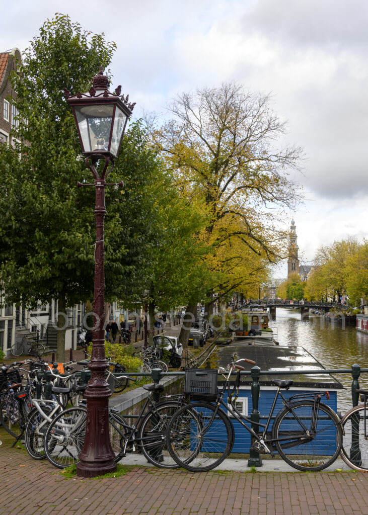 Autumn colours along the Prinsengracht with the Westerkerk in the distance