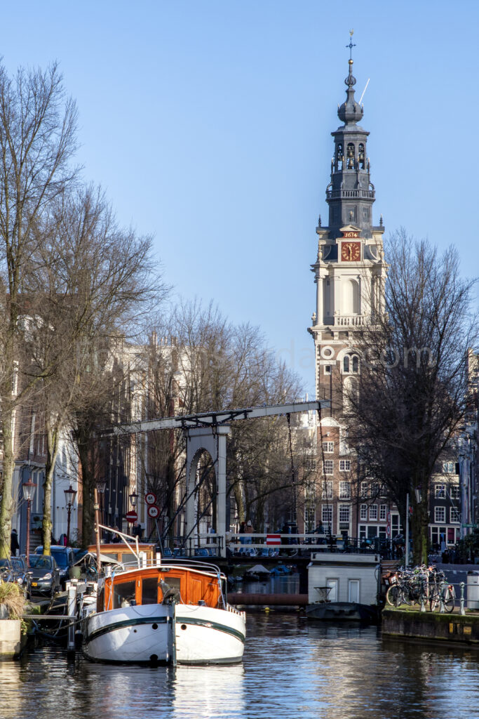 Historic Staalmeestersbrug with the Zuiderkerk rising above Amsterdam's canals